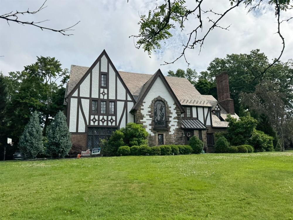 Tudor home exterior after a full repaint